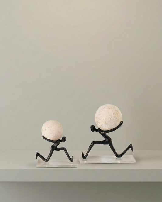 Chasing Balance Travertine Sculpture, front view on neutral background