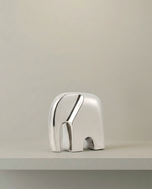 Chrome Elephant Sculpture, front view on neutral background