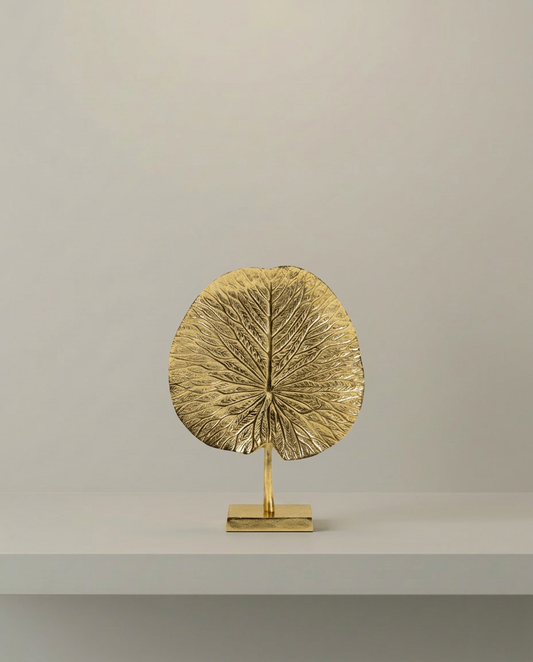 Gold Lotus Leaf Ornament, front view on neutral background