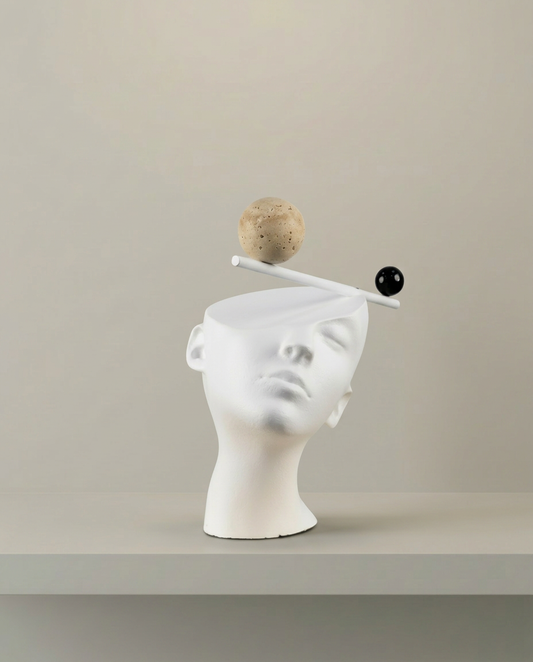 Balance Head Sculpture, front view on neutral background