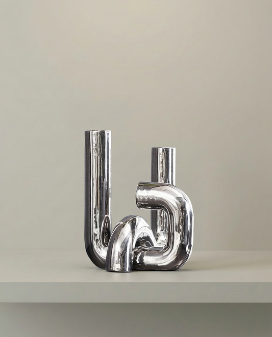 Chrome Tube Sculpture, front view on neutral background