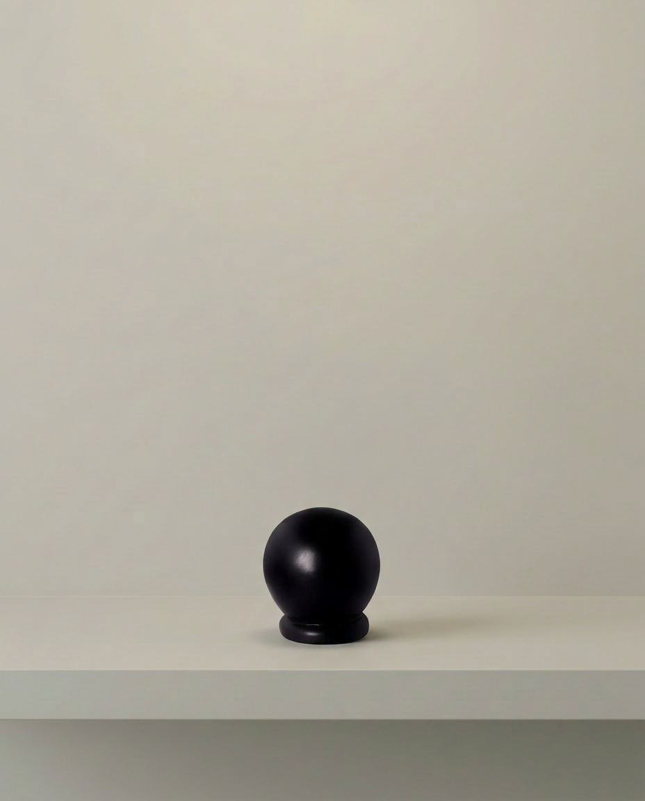 Dark Orb Sculpture, front view on neutral background