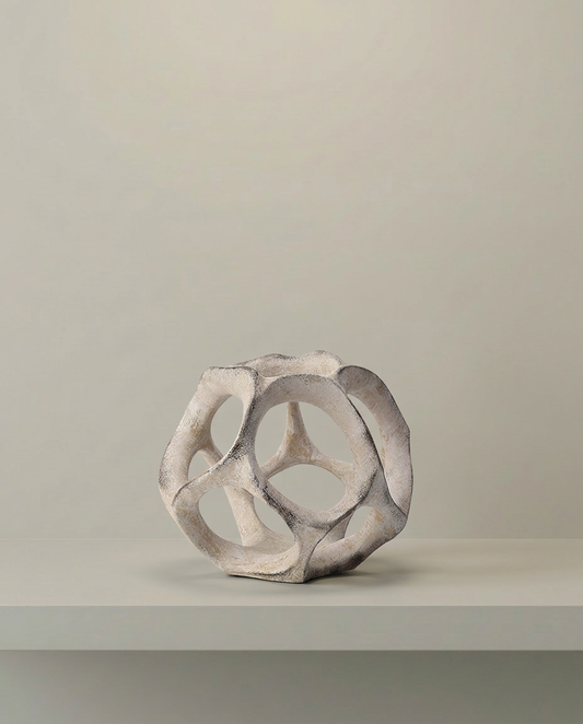 Faceted Orb Sculpture, front view on neutral background