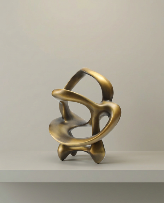 Gold Ribbon Sculpture, front view on neutral background