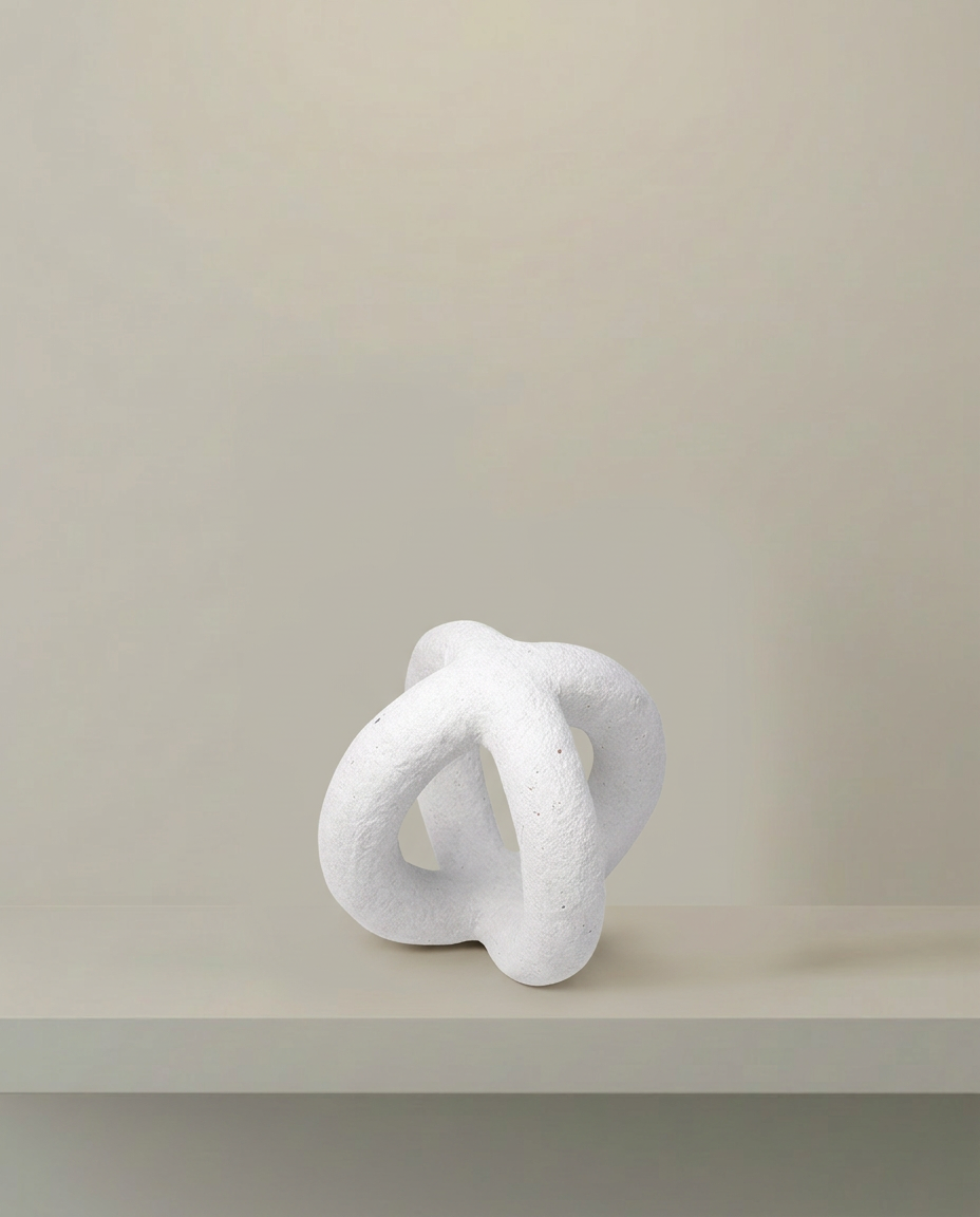 Looped Knot Sculpture, front view on neutral background
