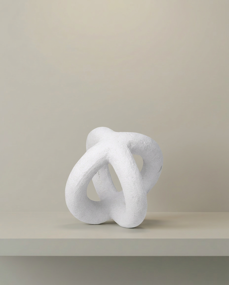 Trefoil Knot Sculpture, front view on neutral background