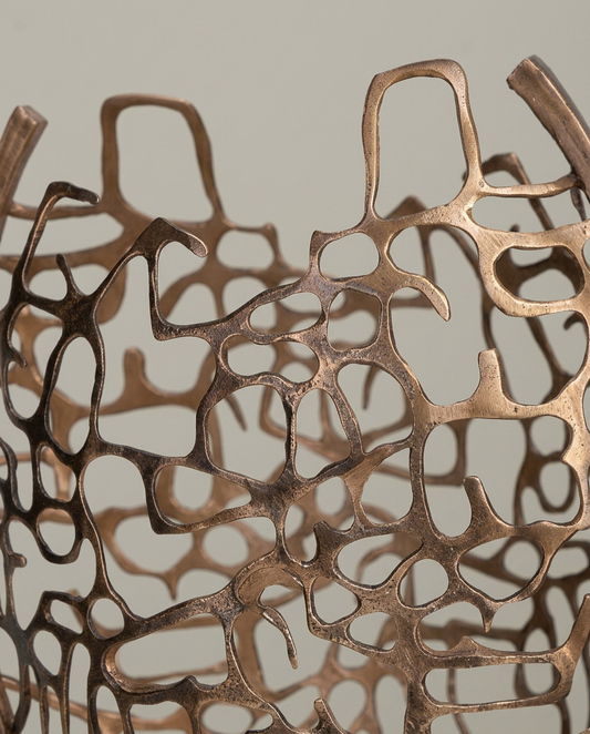 Woven Gold Sculpture on Marble Base, close-up detail showing texture and material