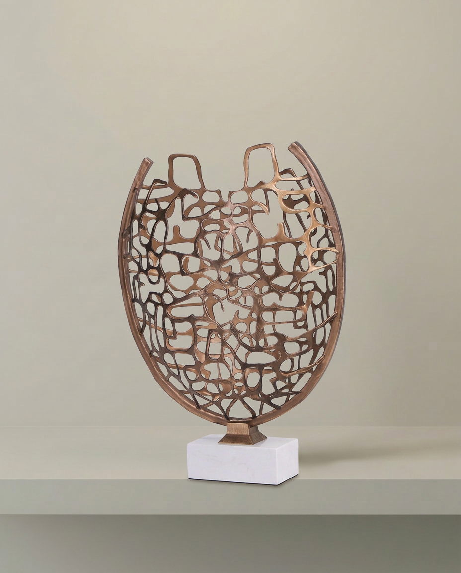 Woven Gold Sculpture on Marble Base, front view on neutral background