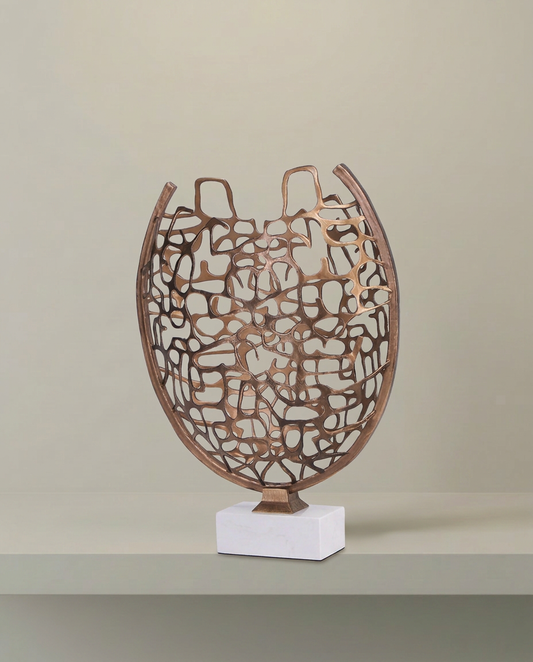 Woven Gold Sculpture on Marble Base, front view on neutral background